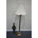 A VICTORIAN STYLE BRASS CORINTHIAN COLUMN STANDARD LAMP, with a single shade, along with a fireplace