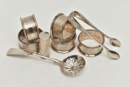 A SMALL PARCEL OF SILVER, comprising a set of five circular napkin rings with engine turned