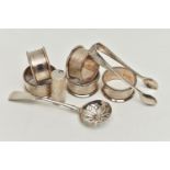 A SMALL PARCEL OF SILVER, comprising a set of five circular napkin rings with engine turned