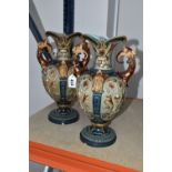 A PAIR OF LATE 19TH CENTURY WILLIAM SCHILLER AND SONS EARTHENWARE TWIN HANDLED VASES, relief