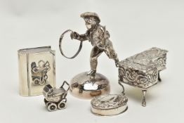 AN ELIZABETH II SILVER FIGURE OF A CHILD WITH HOOP AND STICK ON A DOMED BASE AND FOUR OTHER ITEMS OF