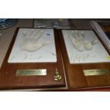 BOXING INTEREST - TWO 'SILK ROAD GIFTS' RESIN PLAQUE HAND PRINTS FOR LARRY HOLMES AND MUHAMMAD