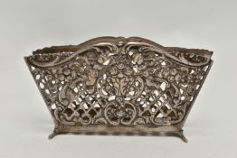 A WHITE METAL LETTER HOLDER, openwork lattice design with floral, foliage and cherub detail, stamped