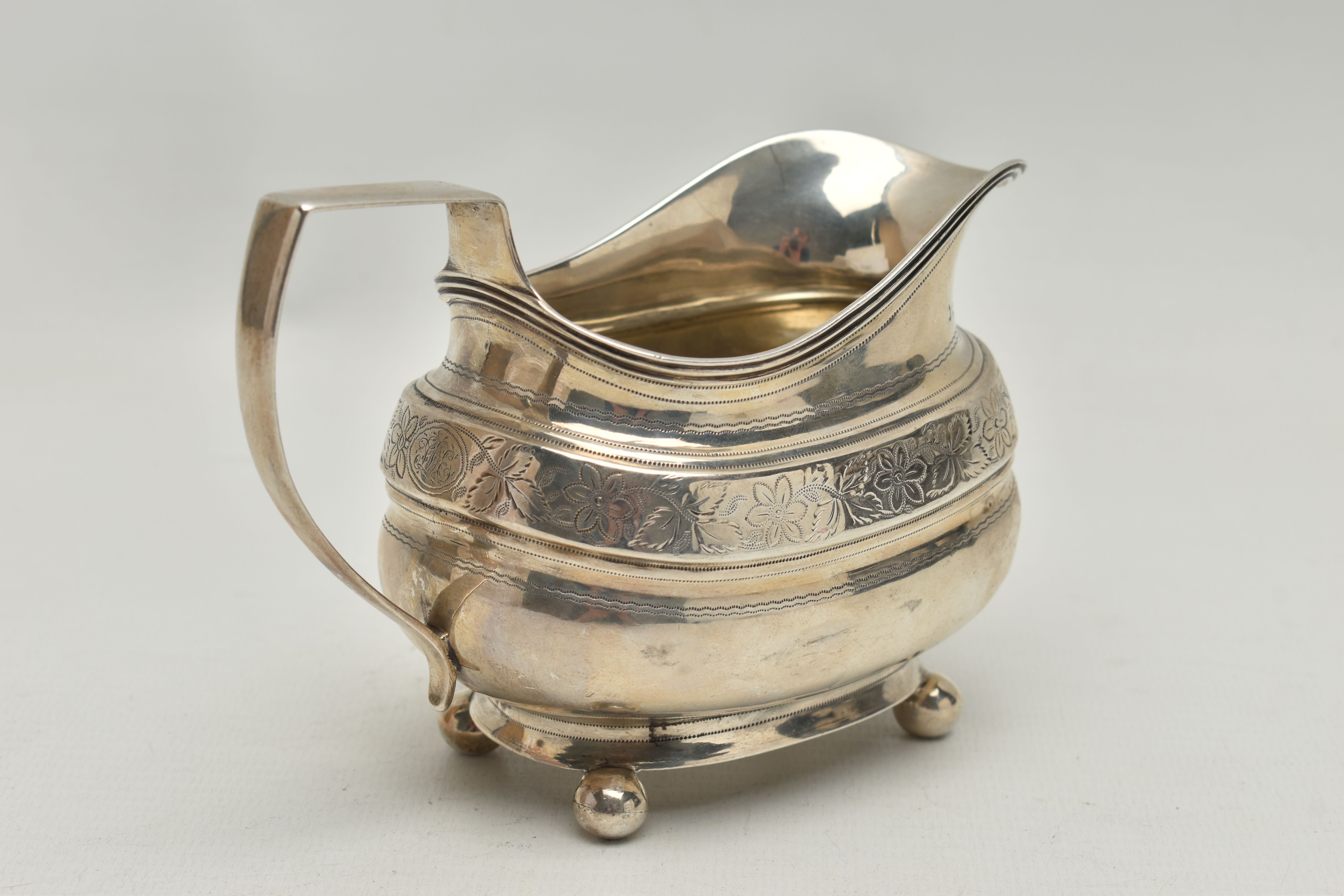 A GEORGE III SILVER HELMET SHAPED MILK JUG OF SHAPED OVAL FORM, angular handle, wriggle work and - Image 3 of 5