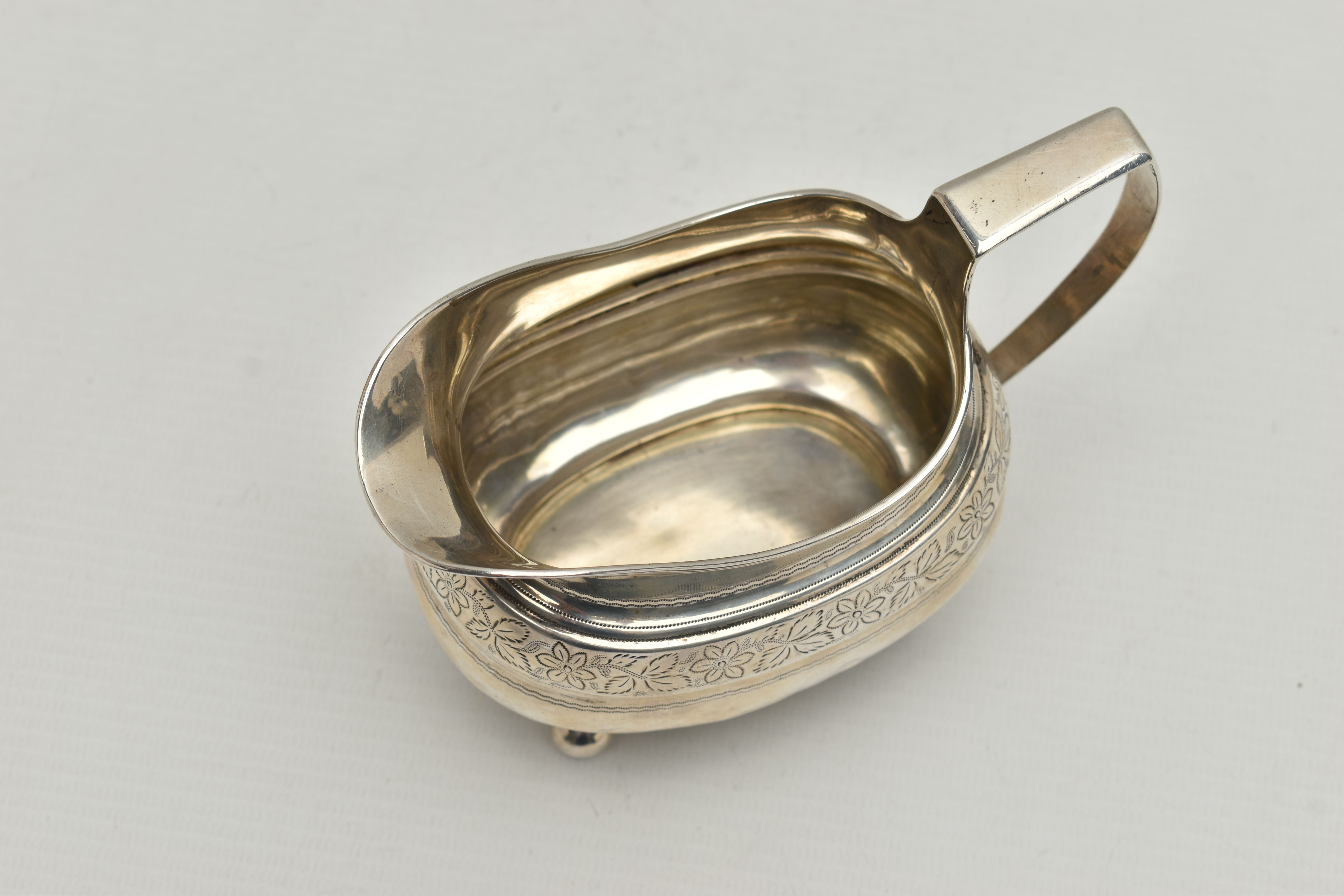 A GEORGE III SILVER HELMET SHAPED MILK JUG OF SHAPED OVAL FORM, angular handle, wriggle work and - Image 5 of 5