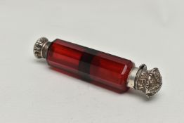 A LATE VICTORIAN DOUBLE ENDED RUBY GLASS SCENT FLASK WITH WHITE METAL MOUNTS, the flask of decagonal