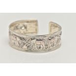 A SILVER CUFF BANGLE, depicting a row of embossed elephants, hallmarked Birmingham, approximate