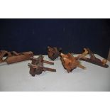 A COLLECTION OF FIVE VINTAGE VICES comprising three beach and brass fillister planes, an Acorn No5