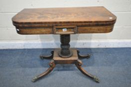 A REGENCY FLAME MAHOGANY CARD TABLE, the fold over top, enclosing a green baize playing surface,