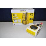 A KARCHER K2 COMPACT in new unused/unopened condition (UNTESTED), along with a Karcher rotary was