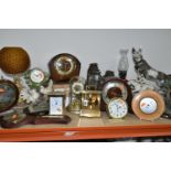 A GROUP OF CLOCKS AND LAMPS, comprising two nautical themed 1960's lamps, three hurricane lamps, two