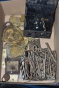 A BOX OF LOCK AND SAFE PARTS, to include brass safe trade plates, lock escutcheon plates, a wooden