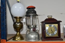 TWO OIL LAMPS AND A FRANZ HERMLE MANTLE CLOCK, made in West Germany, two jewells with key, missing
