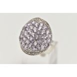 A WHITE METAL AMETHYST DRESS RING, large oval form set with pale amethysts, ring head measuring