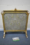 A 19TH CENTURY GILT FRAMED FIRE SCREEN, with crown on a cushion pediment, foliate scrolls,