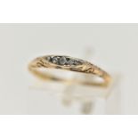 A YELLOW METAL FIVE STONE DIAMOND RING, set with a row of small old cut and diamond chips, to a