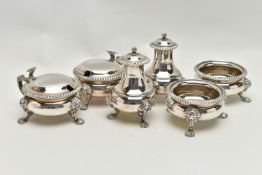 A GEORGE V MAPPIN & WEBB SILVER SIX PIECE CRUET SET OF CIRCULAR FORM, with cast rims and on three