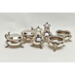 A GEORGE V MAPPIN & WEBB SILVER SIX PIECE CRUET SET OF CIRCULAR FORM, with cast rims and on three