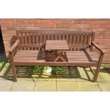 A WOODEN SLATTED GARDEN BENCH with a centre pop up table, length 160cm (condition:-centre table