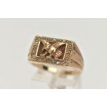 A 9CT GOLD EAGLE SIGNET RING, of a rectangular form depicting a flying eagle, in a surround of