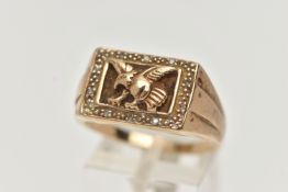 A 9CT GOLD EAGLE SIGNET RING, of a rectangular form depicting a flying eagle, in a surround of