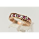 A 9CT GOLD RUBY AND DIAMOND HALF ETERNITY RING, set with a row of alternating rubies and single