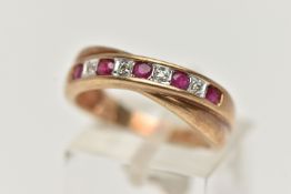 A 9CT GOLD RUBY AND DIAMOND HALF ETERNITY RING, set with a row of alternating rubies and single