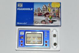 MANHOLE GAME & WATCH BOXED, box only contains minor wear and tear, the system's batteries require