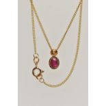 A 9CT GOLD RUBY AND DIAMOND PENDANT NECKLACE, the pendant set with an oval cut ruby collet set in