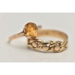 A 9CT GOLD CITRINE RING AND A YELLOW METAL RING, the first a yellow gold ring set with an oval cut
