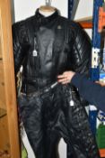 A SET OF LADIES BIKER LEATHERS, comprising a black leather protective biker's jacket, UK size 42,