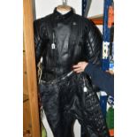 A SET OF LADIES BIKER LEATHERS, comprising a black leather protective biker's jacket, UK size 42,