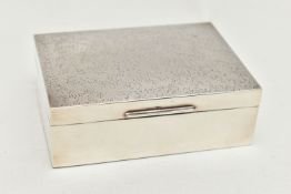 AN ELIZABETH II SILVER RECTANGULAR CIGARETTE BOX, textured finish to the hinged cover, cedar wood