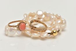 TWO RINGS AND A CULTURED PEARL NECKLACE, the first a coral cabochon ring, bifurcated shoulders