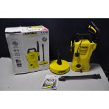 A KARCHER K2.130 HIGH PRESSURE WASHER in original box with hose, lance and a rotating patio brush (