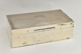 A GEORGE V SILVER RECTANGULAR CIGARETTE BOX, engine turned hinged cover with vacant cartouche, two