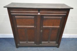 A PART 17TH CENTURY OAK WAINSCOT CUPBOARD, with a half hinged compartment to the top, double