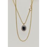 A 9CT GOLD SAPPHIRE AND DIAMOND CLUSTER PENDANT NECKLACE, the oval cluster set with an oval cut blue