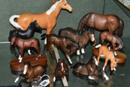 A GROUP OF BESWICK AND ROYAL DOULTON HORSES, comprising a Palomino Swish Tail Horse no 1182, a Shire