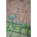 A WIRE GARDEN PLANTER STAND, along with a pair of wire obelisks (3)
