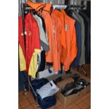 A BOX AND LOOSE CLOTHING, to include orange speedway overalls with cloth badges, a British
