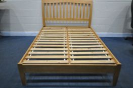 A MODERN BEECH 4FT6 BEDSTEAD, with side rails and slats