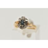 AN 18CT GOLD, SAPPHIRE AND DIAMOND RING, centring on an oval cut blue sapphire in an eight claw