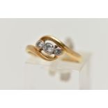 AN 18CT GOLD THREE STONE DIAMOND RING, set with a central old cut diamond, flanked with a round