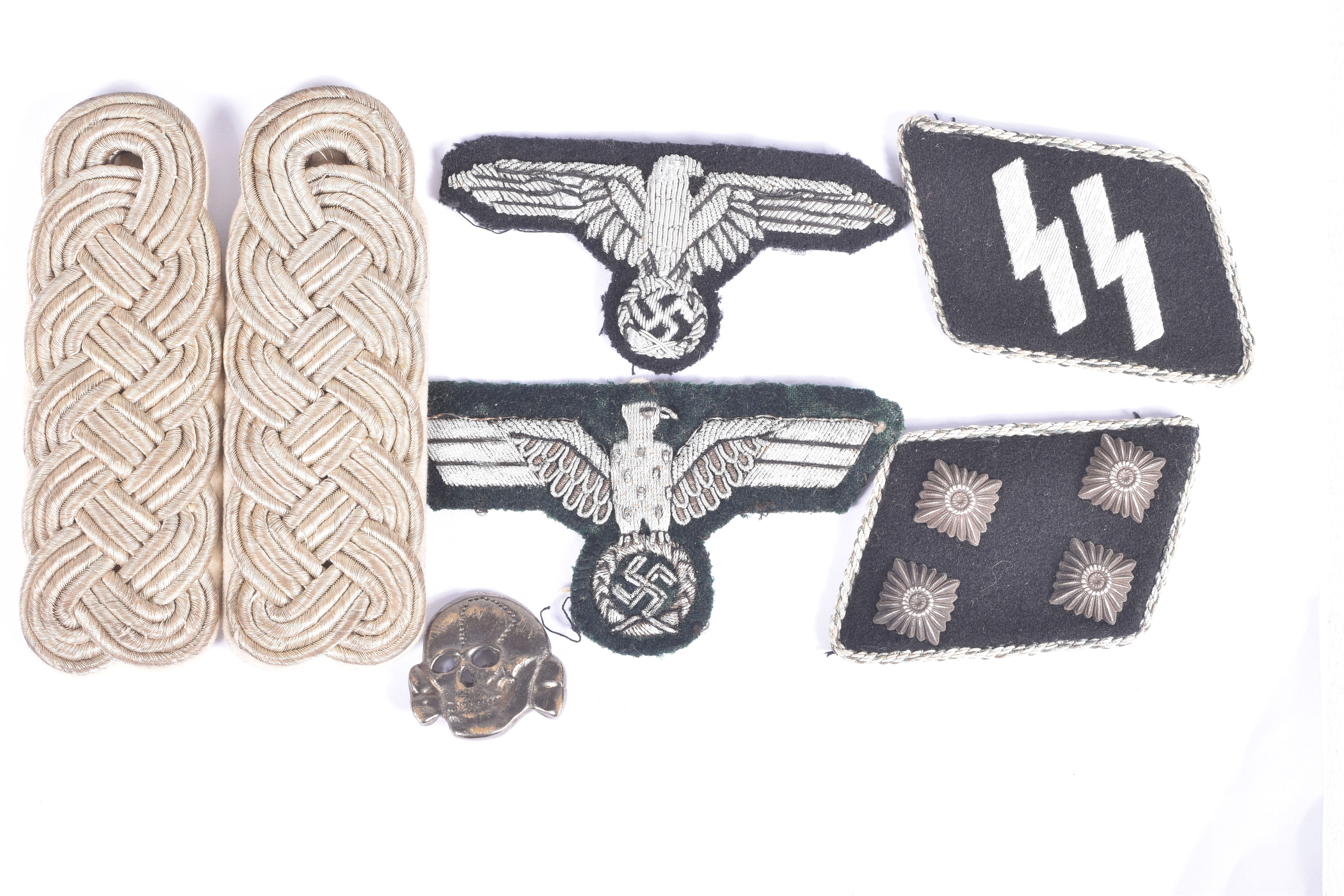 A SMALL COLLECTION OF GERMAN UNIFORM RELATED ITEMS, to include breast eagles, shoulder boards,
