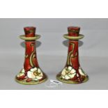 A PAIR OF MINTON No.1 SECESSIONIST ART NOUVEAU CANDLE STICKS, green tube lined decoration of cream