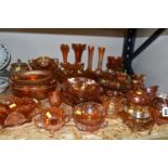 A LARGE QUANTITY OF CARNIVAL GLASSWARE, traditional orange colour, comprising a preserve pot,