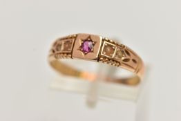 A LATE VICTORIAN 15CT GOLD RING, designed with a star set circular cut ruby, flanked with