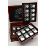 A CASED SET OF 37 USA SILVER EAGLE COINS, each of the coins are individually slabbed and