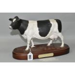 A ROYAL DOULTON FRIESIAN COW, standing on a wooden plinth, model no A2607, height including plinth